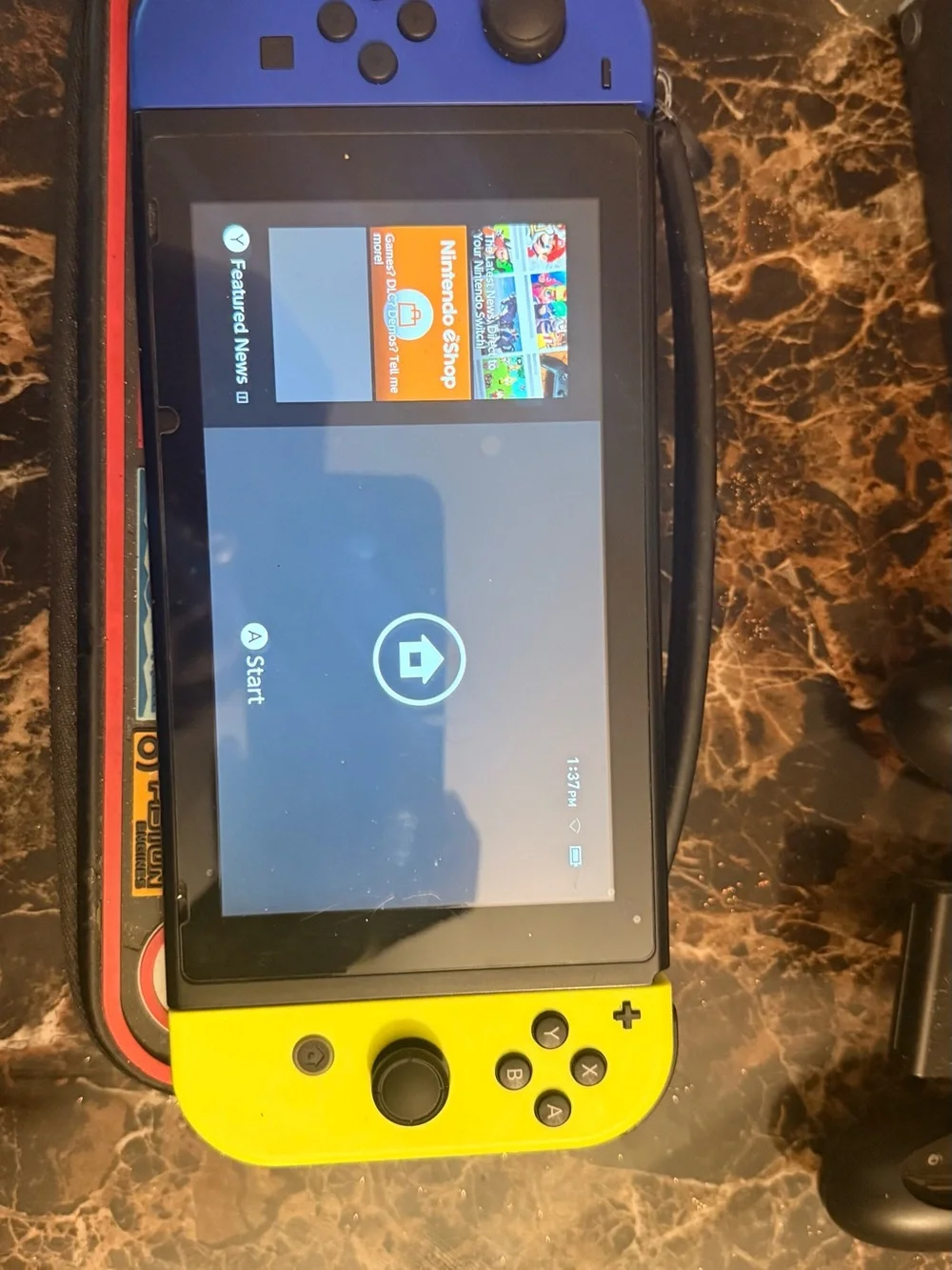 Nintendo Switch with Blue Left & Yellow Right Joy-Con